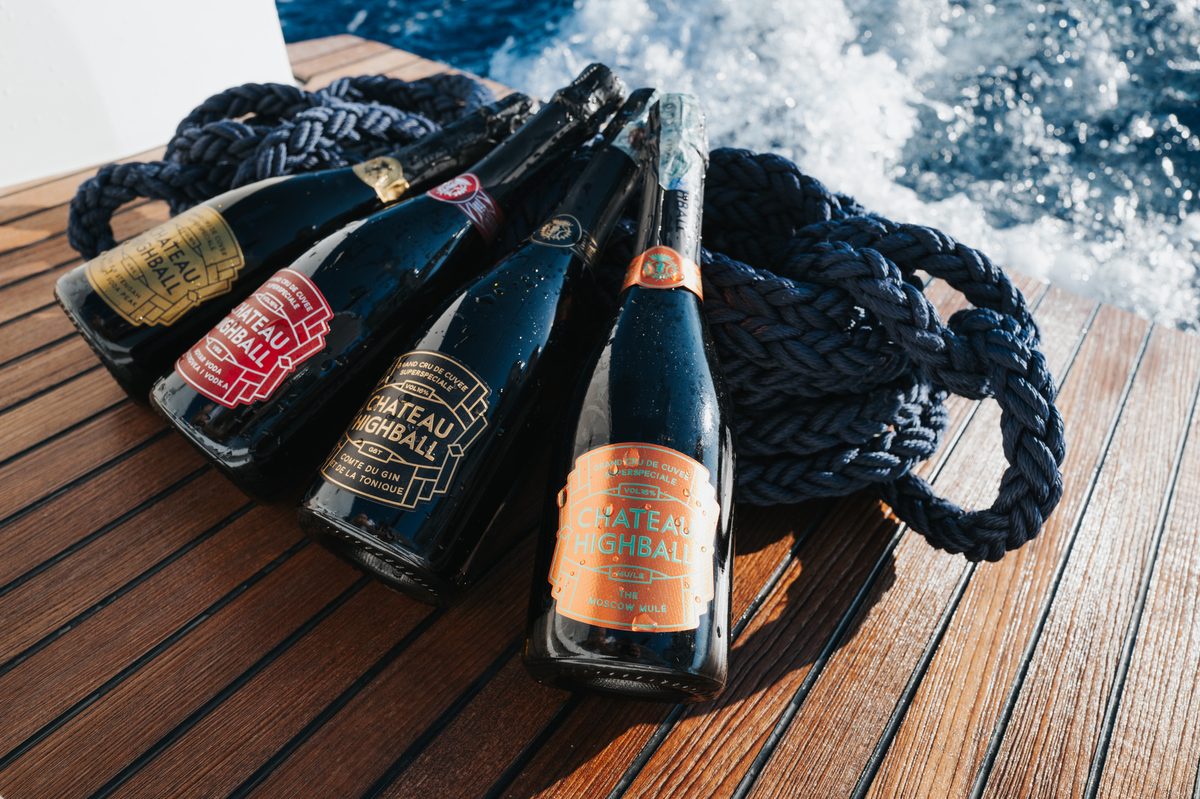 Product shot of bottles on the teak deck with sea spray